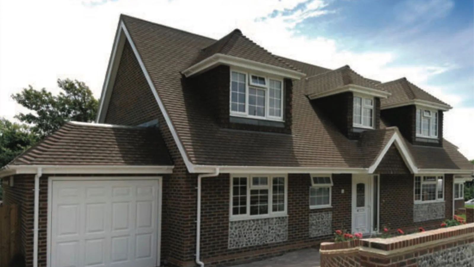 A tiled pitched roof and dormer windows